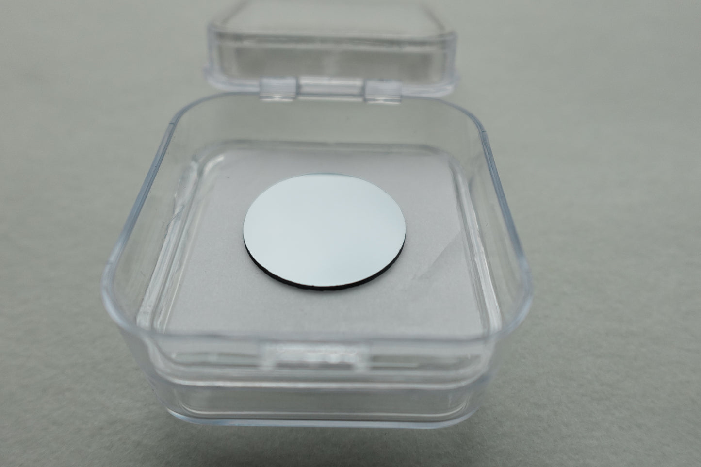 Bruker_compatible_zerp_background_sample_disk_in_packaging_open